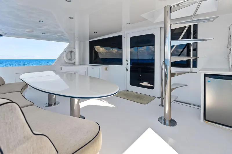 Bravo Zulu Yacht Photos Pics Luxurious 1997 Westship Raised Pilothouse Motor Yacht interior with modern seating and ocean view.