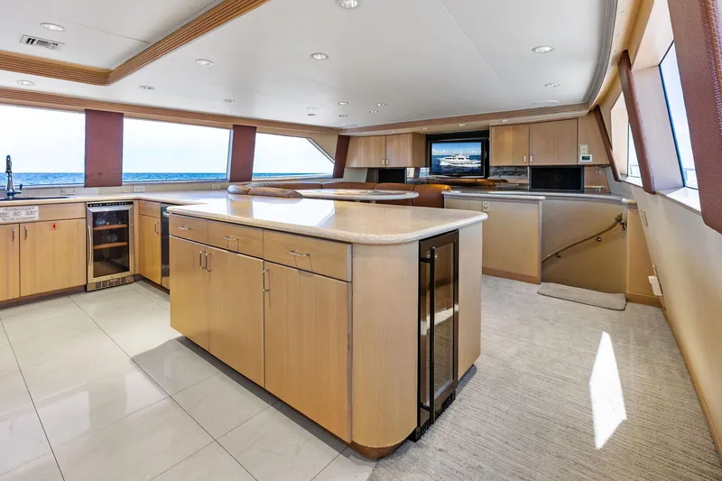 Bravo Zulu Yacht Photos Pics Luxurious interior of 1997 Westship Raised Pilothouse Motor Yacht with modern kitchen and ocean view.