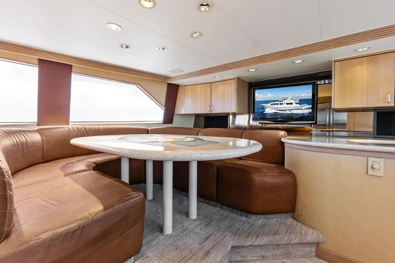 Bravo Zulu Yacht Photos Pics Luxurious 1997 Westship Raised Pilothouse Motor Yacht interior with leather seating and elegant dining area.