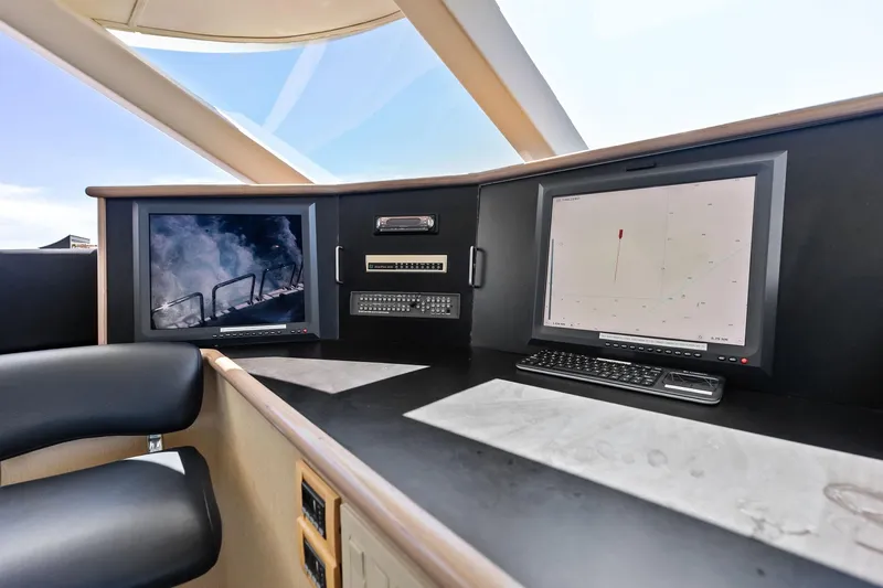 Bravo Zulu Yacht Photos Pics Pilothouse interior of 1997 Westship Raised Pilothouse Motor Yacht with navigation screens.