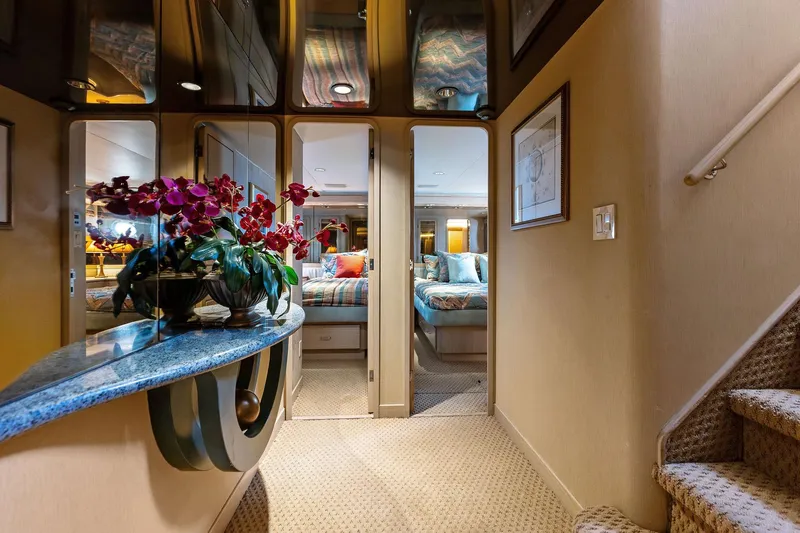 Bravo Zulu Yacht Photos Pics Luxurious interior of 1997 Westship Raised Pilothouse Motor Yacht with elegant decor and floral arrangement.