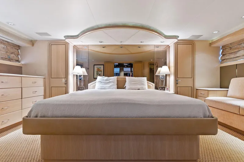 Bravo Zulu Yacht Photos Pics Luxurious bedroom interior of 1997 Westship Raised Pilothouse Motor Yacht with elegant furnishings.