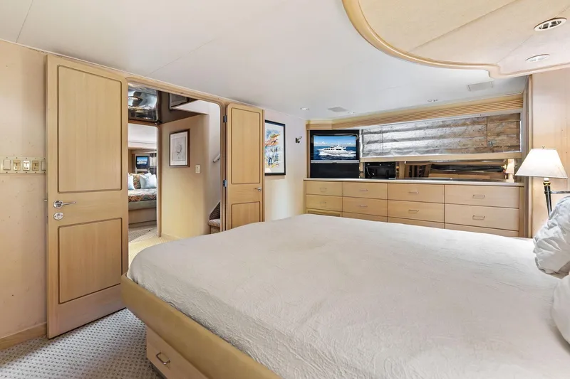 Bravo Zulu Yacht Photos Pics Luxurious bedroom interior of 1997 Westship Raised Pilothouse Motor Yacht with elegant furnishings.