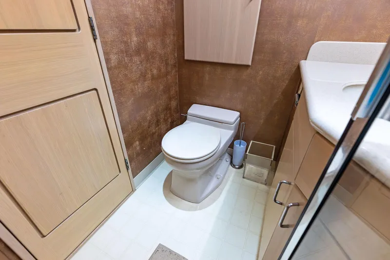 Bravo Zulu Yacht Photos Pics Bathroom interior of 1997 Westship Raised Pilothouse Motor Yacht, featuring modern fixtures.