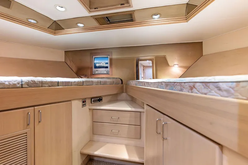 Bravo Zulu Yacht Photos Pics Luxurious 1997 Westship Raised Pilothouse Motor Yacht cabin with twin beds and elegant wood finish.