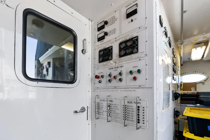 Bravo Zulu Yacht Photos Pics Control panel inside 1997 Westship Raised Pilothouse Motor Yacht, featuring various switches and gauges.