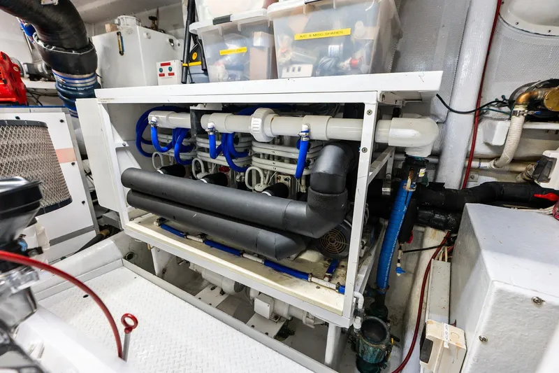 Bravo Zulu Yacht Photos Pics Engine room of 1997 Westship Raised Pilothouse Motor Yacht with complex piping system.