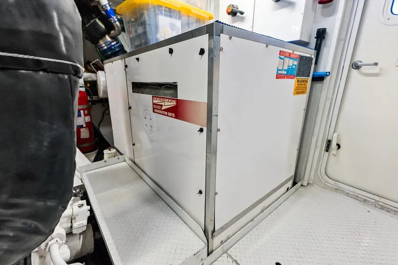 Bravo Zulu Yacht Photos Pics Engine room of 1997 Westship Raised Pilothouse Motor Yacht with generator and safety equipment.