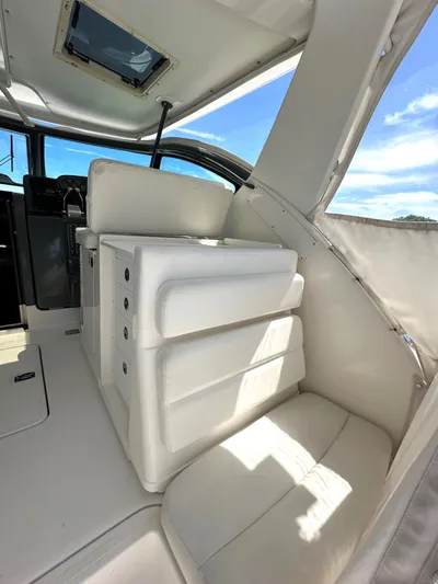  Yacht Photos Pics 2001 Tiara Yachts 3800 Open interior with white seating and helm station.