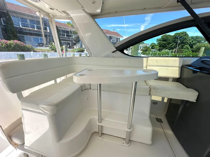  Yacht Photos Pics 2001 Tiara Yachts 3800 Open interior seating area with table.