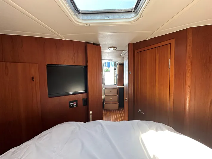  Yacht Photos Pics Interior cabin of 2001 Tiara Yachts 3800 Open with wood paneling and skylight.