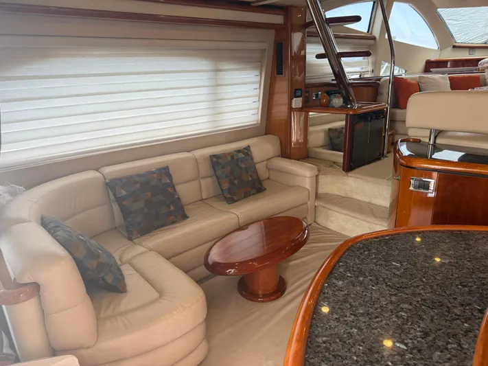 Sunshine Yacht Photos Pics Luxurious interior of 2004 Sunseeker Manhattan 64 yacht with elegant seating and modern design.