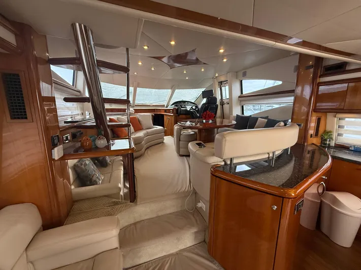 Sunshine Yacht Photos Pics Luxurious interior of 2004 Sunseeker Manhattan 64 yacht with elegant seating and modern design.
