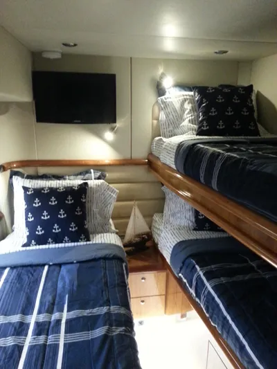 Sunshine Yacht Photos Pics Interior of 2004 Sunseeker Manhattan 64 yacht with nautical-themed bunk beds.