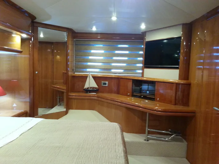 Sunshine Yacht Photos Pics Luxurious interior of 2004 Sunseeker Manhattan 64 yacht with wood paneling and modern amenities.