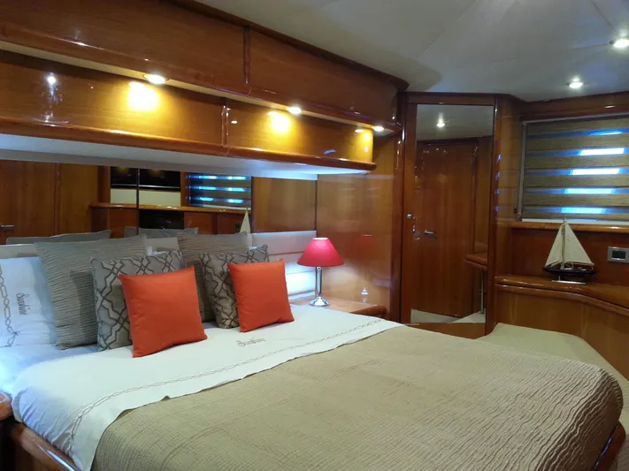 Sunshine Yacht Photos Pics Luxurious cabin interior of 2004 Sunseeker Manhattan 64 yacht with elegant wood finish.