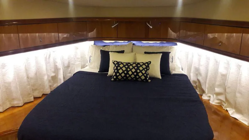 Sunshine Yacht Photos Pics Luxurious cabin interior of 2004 Sunseeker Manhattan 64 yacht with elegant bedding.