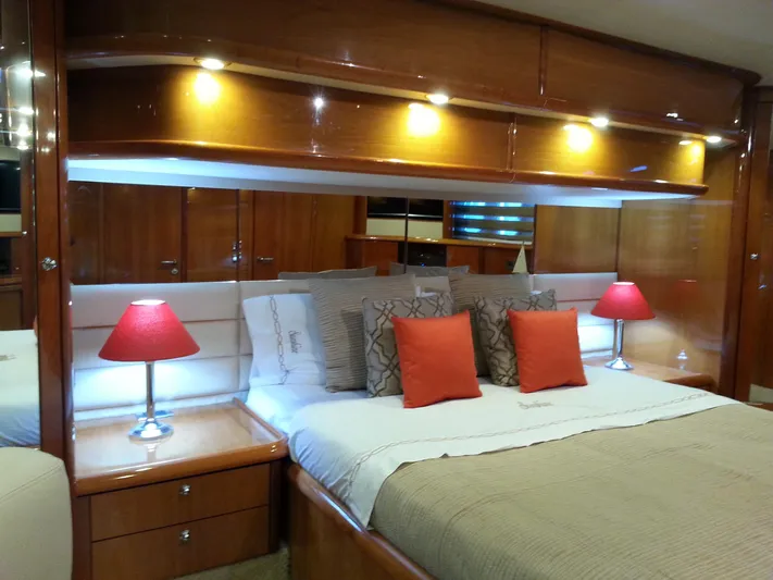 Sunshine Yacht Photos Pics Luxurious bedroom interior of 2004 Sunseeker Manhattan 64 yacht with elegant lighting and decor.