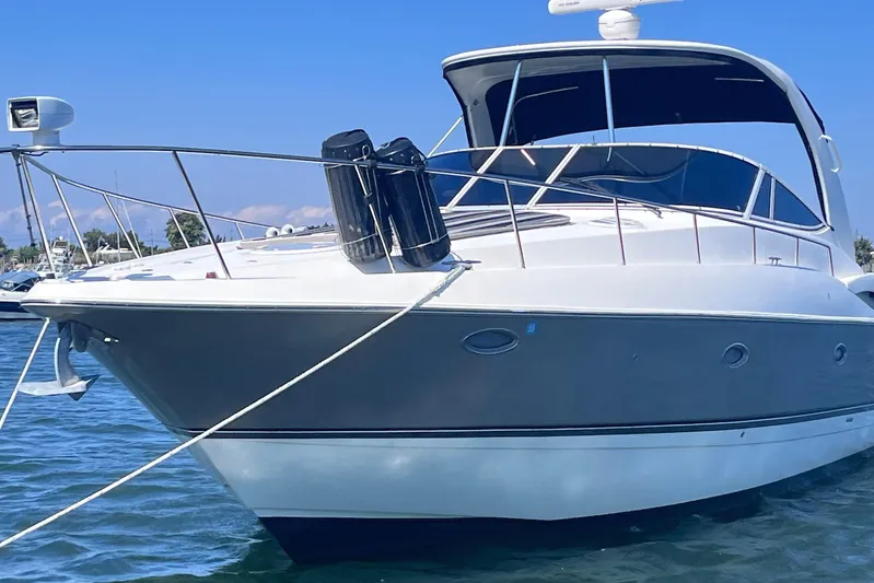  Yacht Photos Pics 2007 Cruisers Yachts 370 Express on water, sleek design, sunny day.