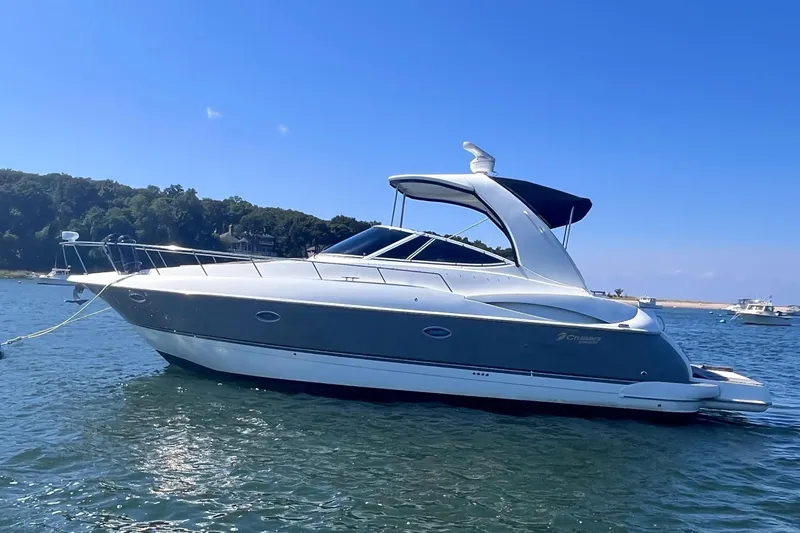  Yacht Photos Pics 2007 Cruisers Yachts 370 Express on calm water, clear sky background.