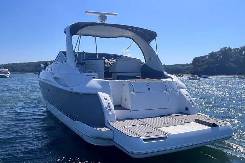  Yacht Photos Pics 2007 Cruisers Yachts 370 Express on water, rear view, sunny day.