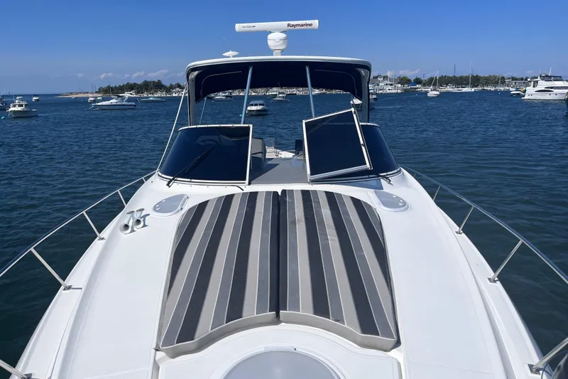  Yacht Photos Pics 2007 Cruisers Yachts 370 Express on water, featuring sleek design and spacious deck.