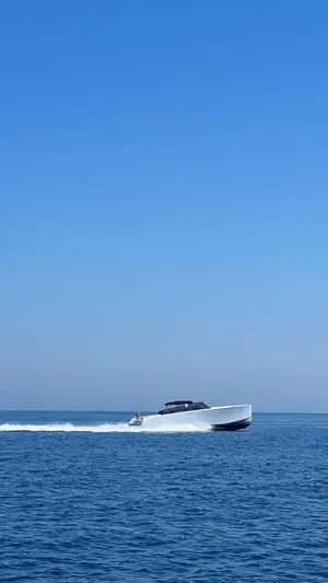  Yacht Photos Pics VanDutch 48 yacht cruising on open sea under clear blue sky, 2021 model.