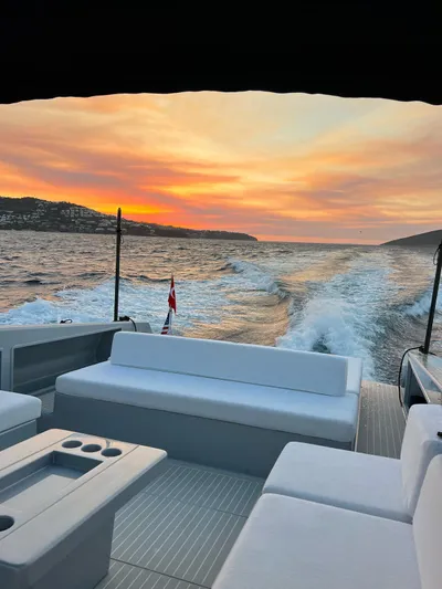  Yacht Photos Pics VanDutch 48 yacht cruising at sunset, 2021 model, with luxurious seating and ocean view.