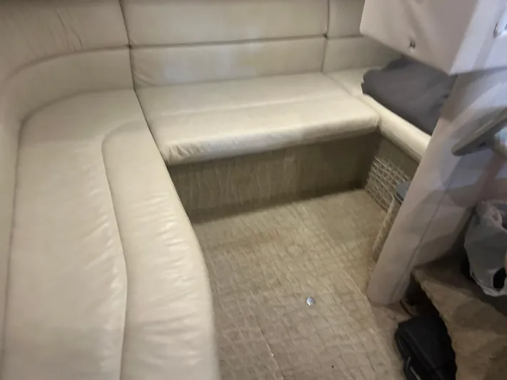  Yacht Photos Pics 2007 Formula 31 PC interior with beige leather seating and carpeted flooring.