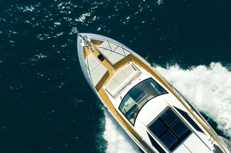 Impulse Yacht Photos Pics Aerial view of 2017 Numarine 62 Hardtop yacht cruising on the ocean.