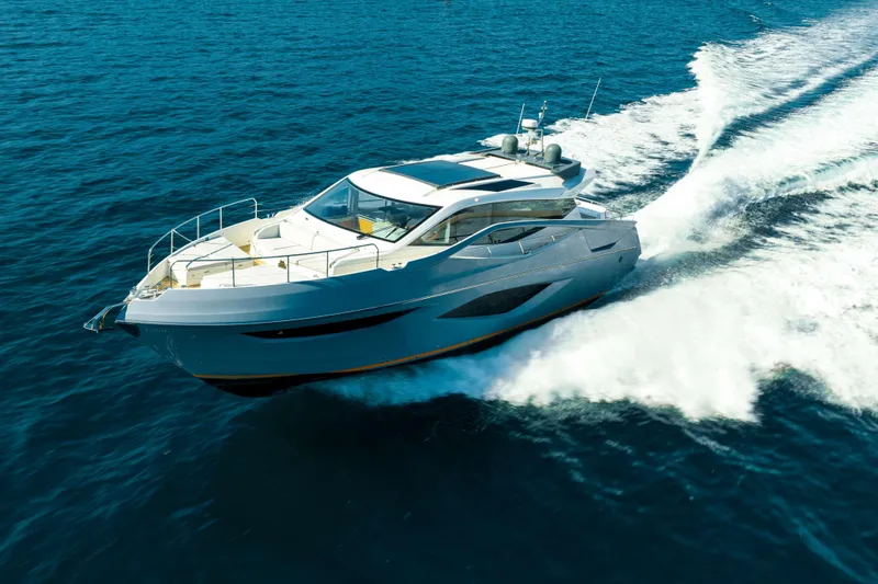 Impulse Yacht Photos Pics 2017 Numarine 62 Hardtop yacht cruising on open sea, creating a dynamic wake.