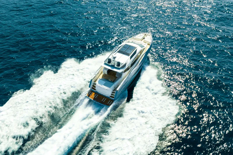 Impulse Yacht Photos Pics 2017 Numarine 62 Hardtop yacht cruising on open sea, aerial view.