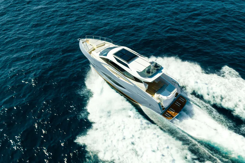 Impulse Yacht Photos Pics Aerial view of 2017 Numarine 62 Hardtop yacht cruising on open sea.