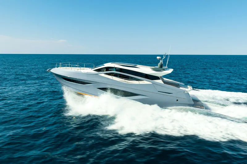 Impulse Yacht Photos Pics 2017 Numarine 62 Hardtop yacht cruising on open sea under clear blue sky.