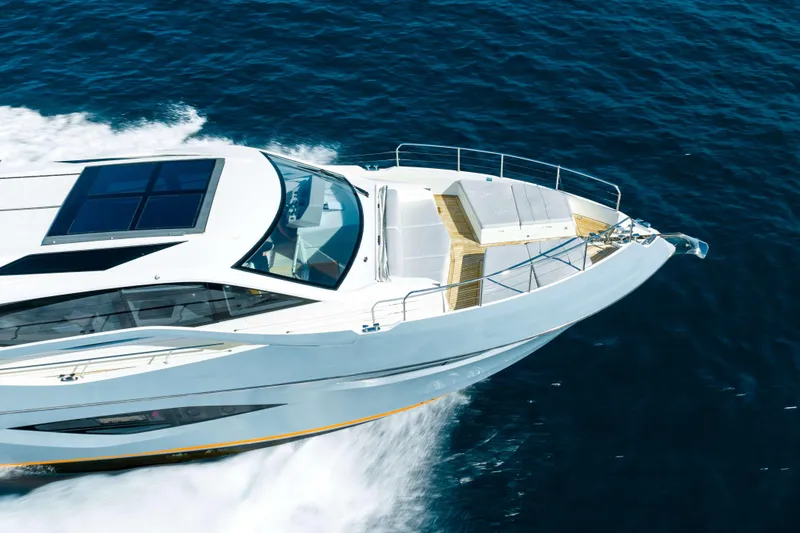 Impulse Yacht Photos Pics 2017 Numarine 62 Hardtop yacht cruising on open sea, showcasing sleek design.