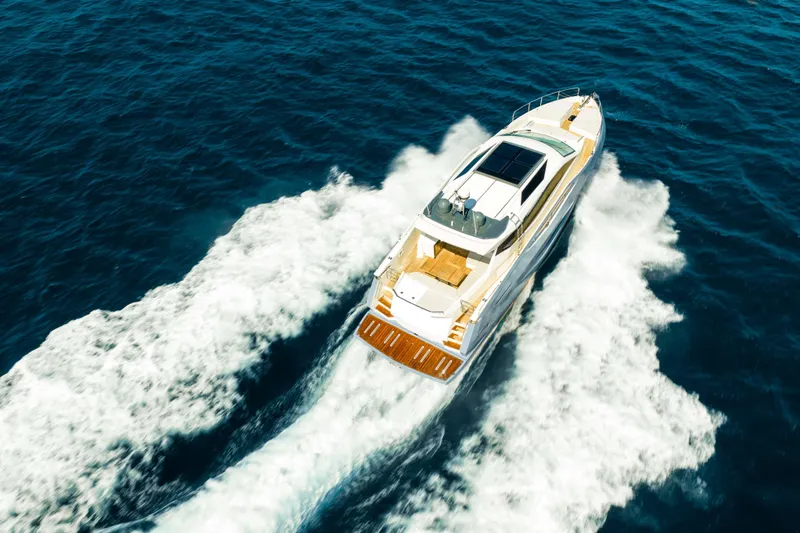 Impulse Yacht Photos Pics Aerial view of 2017 Numarine 62 Hardtop yacht cruising on open sea.