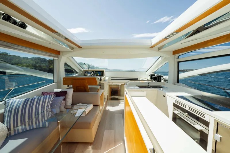Impulse Yacht Photos Pics Luxurious interior of 2017 Numarine 62 Hardtop yacht with modern design and scenic ocean view.