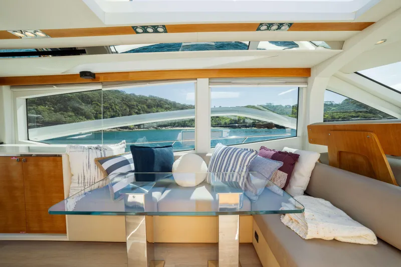 Impulse Yacht Photos Pics Luxurious interior of 2017 Numarine 62 Hardtop yacht with scenic ocean view.