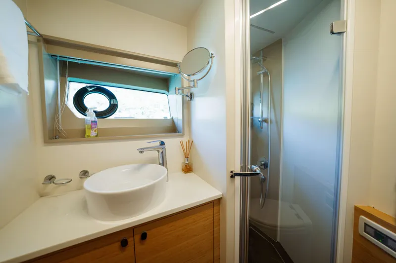 Impulse Yacht Photos Pics Luxurious bathroom in 2017 Numarine 62 Hardtop yacht with modern fixtures and shower.