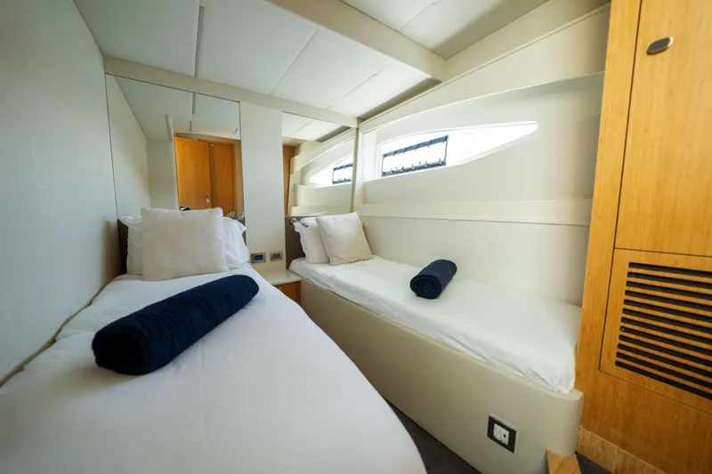 Impulse Yacht Photos Pics Luxurious twin cabin interior of 2017 Numarine 62 Hardtop yacht, featuring modern design.