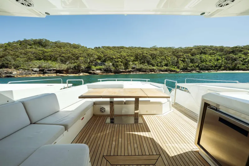 Impulse Yacht Photos Pics Luxurious 2017 Numarine 62 Hardtop yacht deck with scenic coastal view.