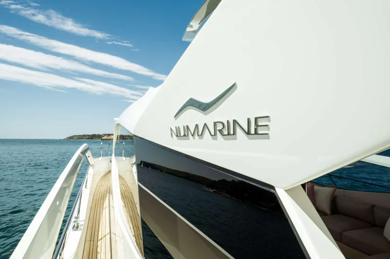 Impulse Yacht Photos Pics 2017 Numarine 62 Hardtop yacht on open water, showcasing sleek design and luxury.