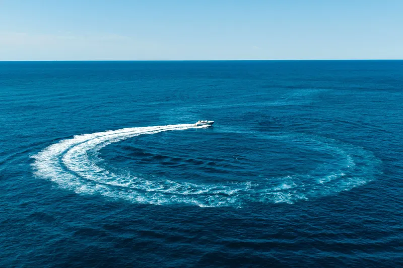 Impulse Yacht Photos Pics Numarine 62 Hardtop 2017 yacht creating circular wake in open ocean.
