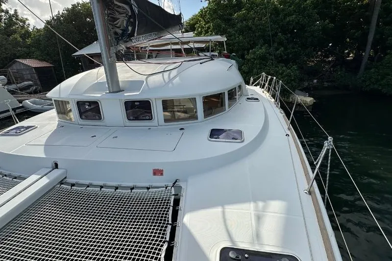 Nacrite Yacht Photos Pics 2018 Lagoon 380 catamaran docked, featuring spacious deck and sleek design.