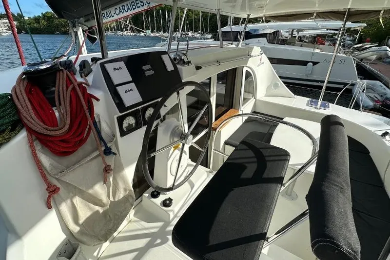 Nacrite Yacht Photos Pics Cockpit of 2018 Lagoon 380 catamaran with steering wheel and navigation instruments.