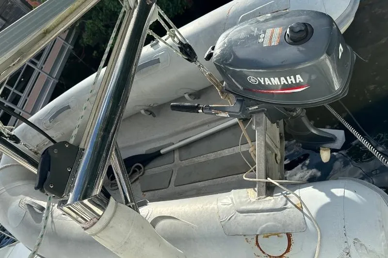 Nacrite Yacht Photos Pics Yamaha outboard motor on a 2018 Lagoon 380 inflatable boat, docked by water.