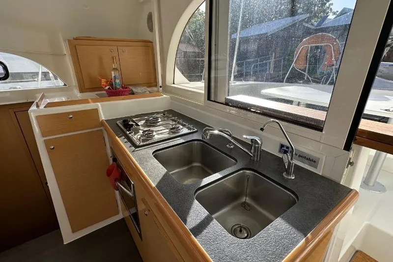 Nacrite Yacht Photos Pics Modern kitchen interior of 2018 Lagoon 380 catamaran with dual sinks and stove.