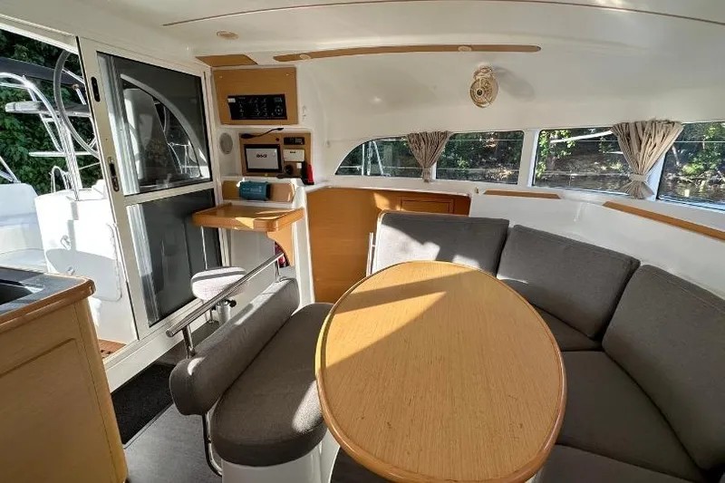 Nacrite Yacht Photos Pics Interior of 2018 Lagoon 380 catamaran with cozy seating and dining area.