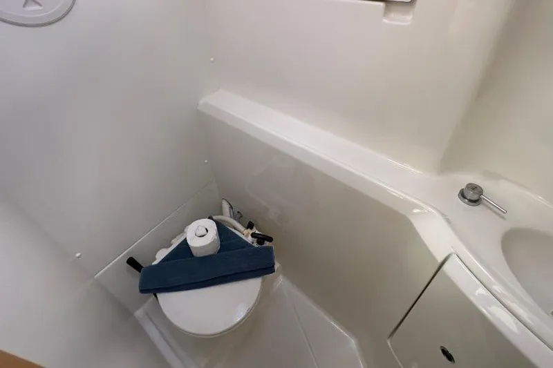 Nacrite Yacht Photos Pics Compact bathroom in 2018 Lagoon 380 catamaran with toilet and sink.