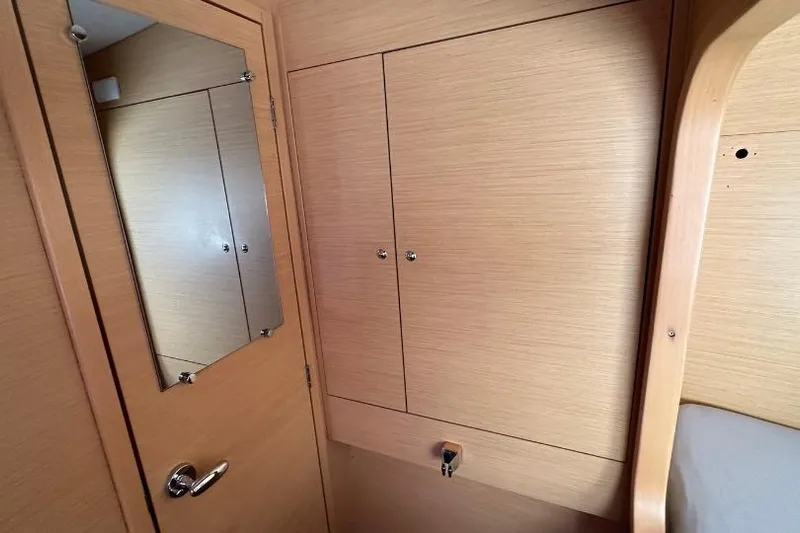 Nacrite Yacht Photos Pics Interior of 2018 Lagoon 380 yacht with wooden cabinetry and mirror.